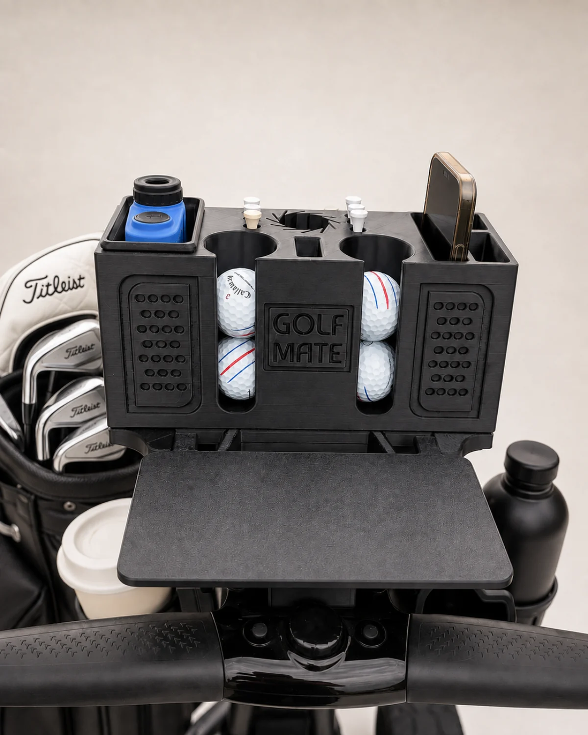 GolfMate Pro organizer with GOLF MATE branding, four golf balls and the foldable table open